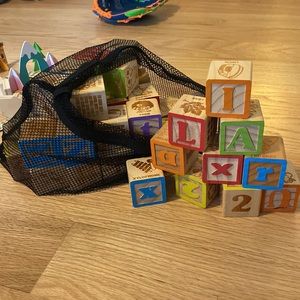 Wooden alphabet block set with bag